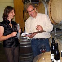 Jane Docherty (winemaker) and Steve Green (general manager) of Carrick discuss 10 vintages of pinot noir. Photo by Charmian Smith.