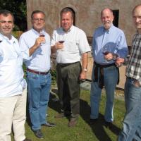 Wine Discovery New Zealand 2010 participants (from left) Manuel de Sampaio and Manuel de Novaes Cabral, both of Porto, Portugal; Bill Dodd, of Napa Valley, California, US, and Tom Perry, of Rioja, Spain, sample a drop with Chard Farm winemaker John Wallace. Photo by James Beech.