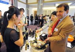 A French wine producer (R) meets South Korean dealers at an event to promote the sales of French wines at a hotel in Seoul 2008. Frustrated by barriers to a strategic Asian market, French wine producers are betting on a new EU-South Korean free trade deal to claw back the massive market share they have lost in the past decade.