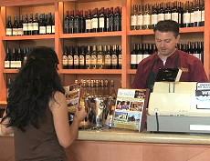 A customer pays for wine at the San Antonio Winery store 